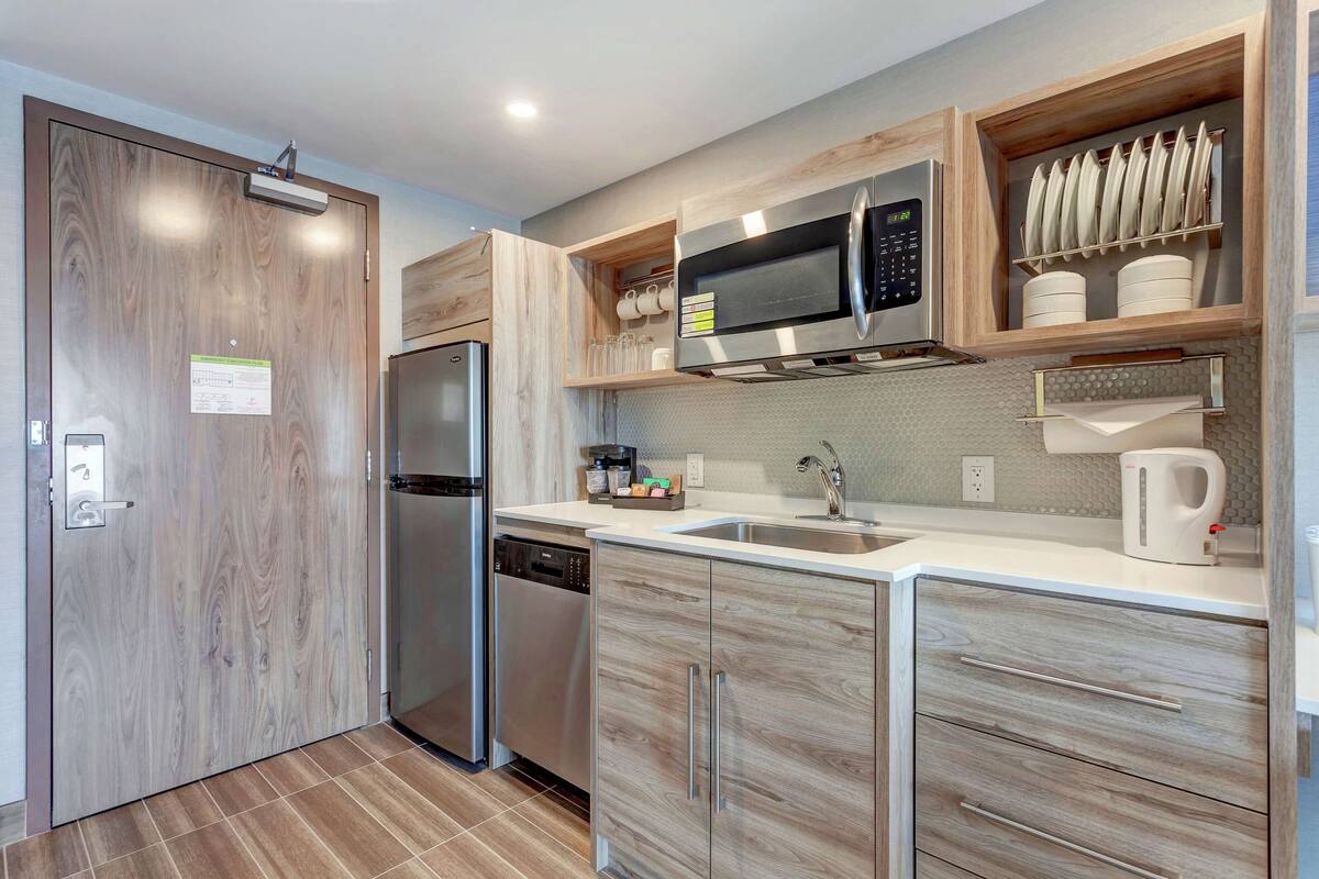 full-sized fridge, microwave, dishwasher, coffee/tea maker