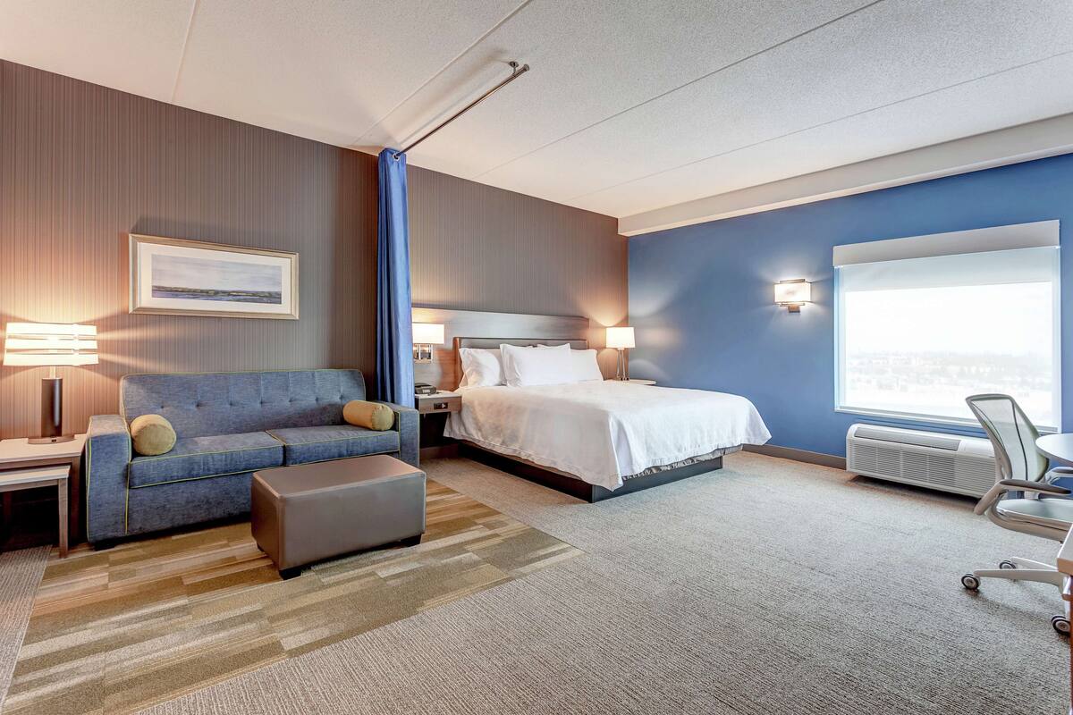 studio, 1 king bed, accessible (mobility & hearing, roll-in shower) | living area | 42-inch lcd tv with cable channels, tv, mp3 dock