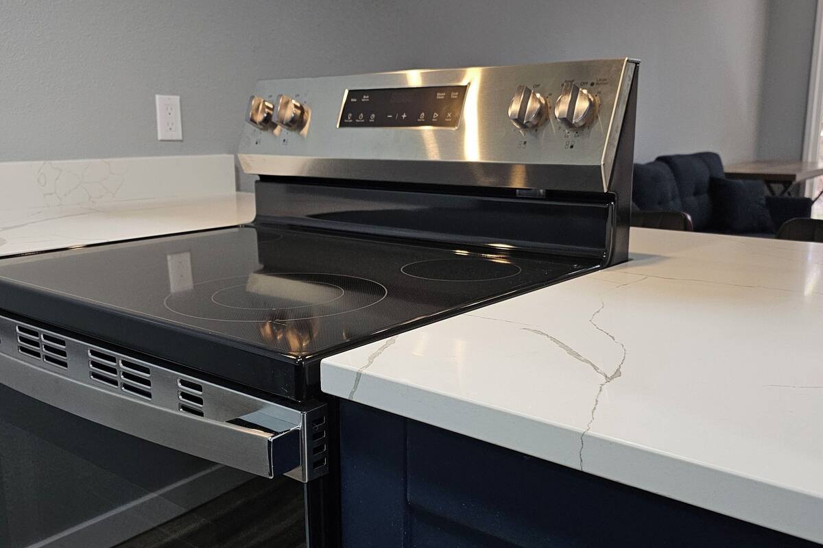 full-sized fridge, microwave, dishwasher, coffee/tea maker