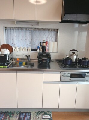 Fridge, microwave, stovetop, coffee/tea maker