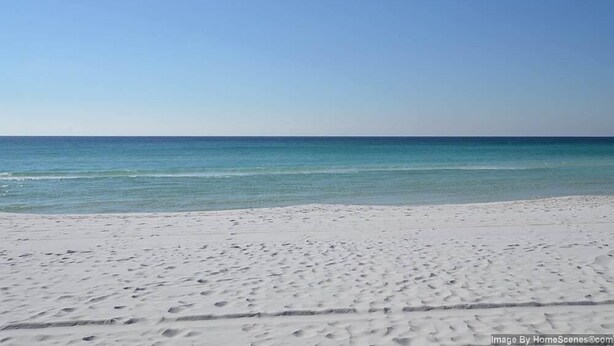 A beach with white sand and calm blue water. - Grand Caribbean East 111 * Fall Special Rates * Salt Water Vacations (Destin)