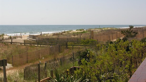 A beach view with a wooden fence, sandy beach, and ocean. - LINENS & DAILY ACTIVITIES INCLUDED*!!! THE CAPRI - 2BR - Ocean View Condo! (Ocean City)