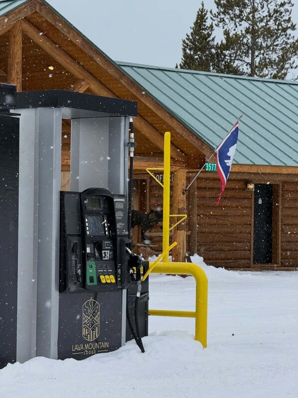 A snow-covered outdoor fuel pump at Lava Mountain Lodge. - Lava Mountain Lodge (Dubois)