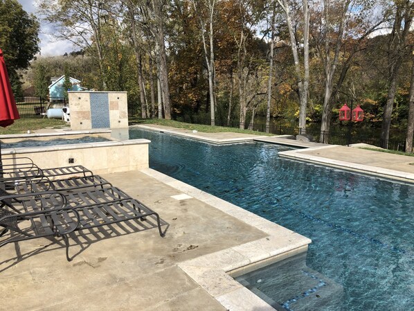 Private resort style pool overlooking the lake 
