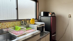 Fridge, microwave, electric kettle, cookware/dishes/utensils