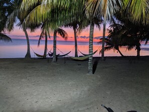 On the beach, sun loungers, beach towels