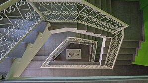 A spiral staircase with ornate metal railings and a geometric pattern. - Enjoy a Holiday of a Lifetime Renting Your Own Apartment in Ayia Napa at the Best Rate (Ayia Napa)