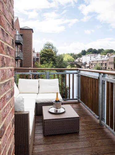 Award winning apartment, central and riverside with terrace and free car parking