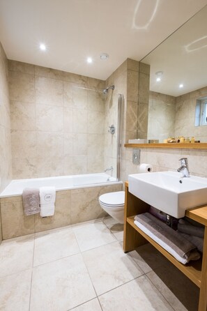 Combined shower/bathtub, hair dryer, towels, soap