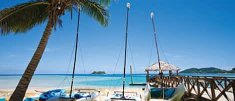 On the beach, sun-loungers, beach towels