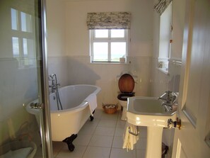 Bathtub, hair dryer, towels, soap