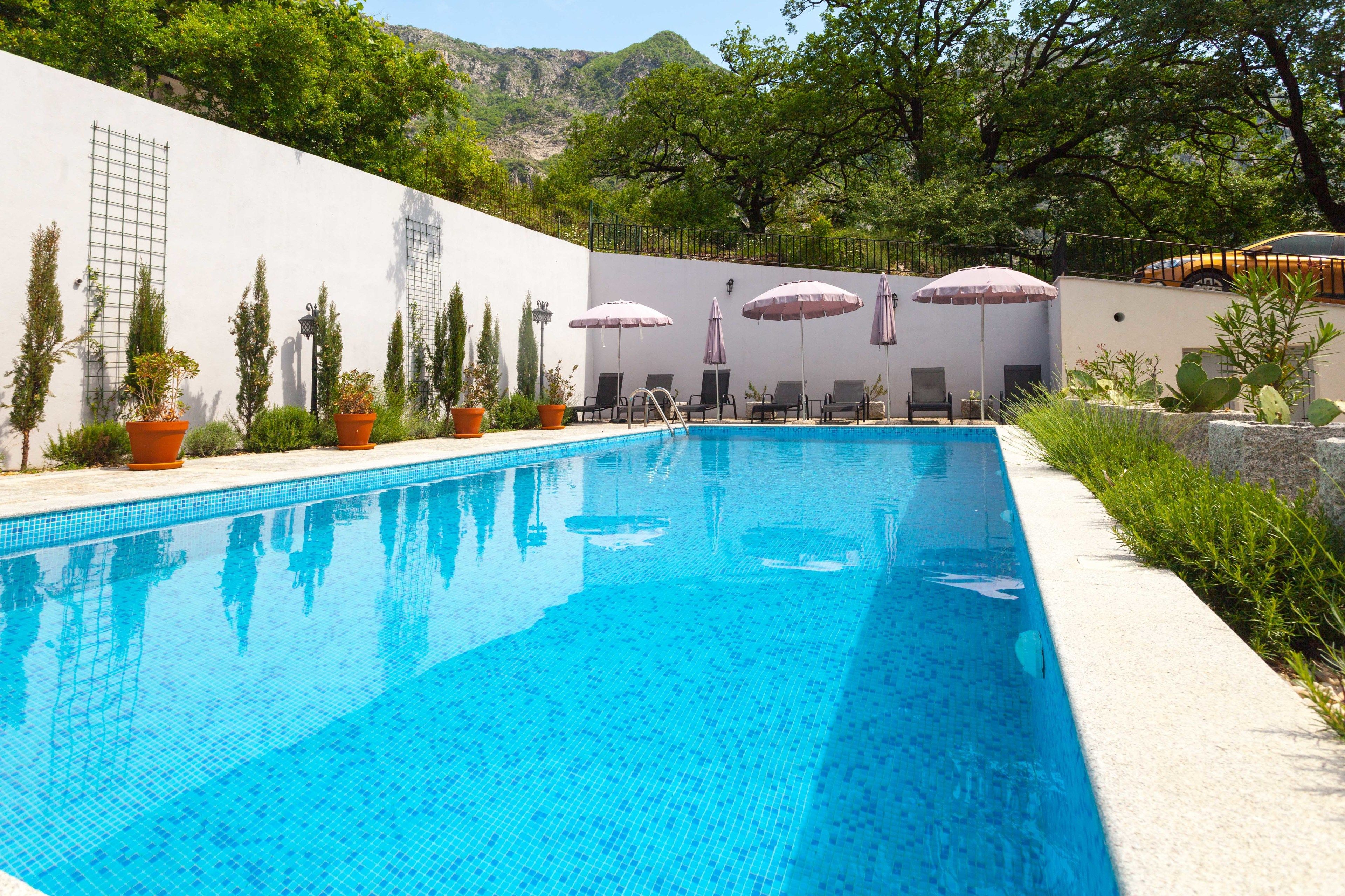 Seasonal outdoor pool, open 8:00 AM to 8:00 PM, pool umbrellas