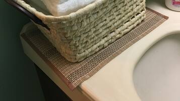 Bathtub, hair dryer, bidet, towels