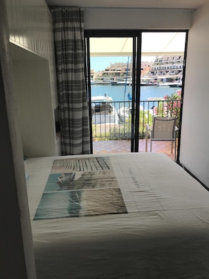 Enjoy a restful stay in this stylish room with a large bed and marina views from the balcony.