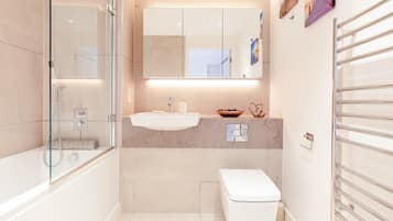 Combined shower/bathtub, hair dryer, towels, soap