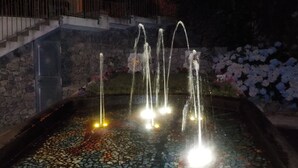 A fountain with multiple water jets, surrounded by a mosaic-tiled basin. - Nice apartment on the Amalfi Coast and close to the Path of the Gods (Pianillo)