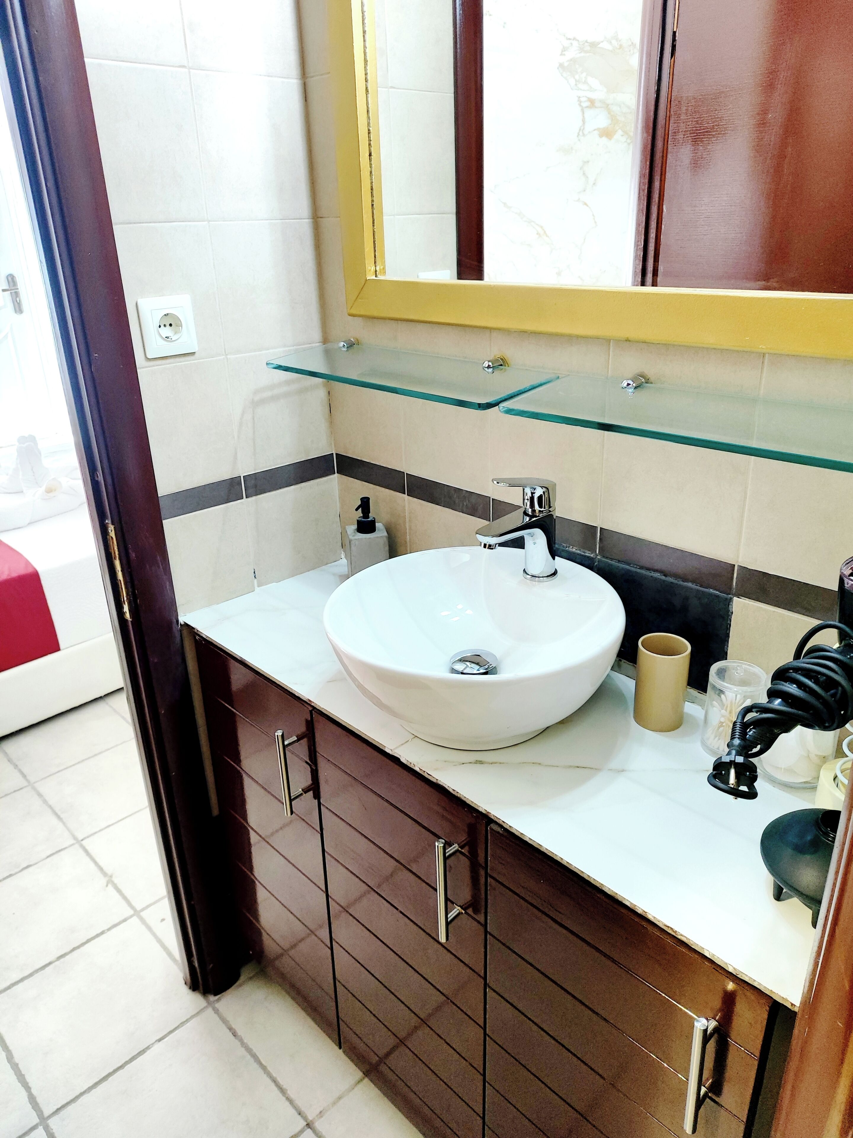 Shower, hair dryer, towels, toilet paper