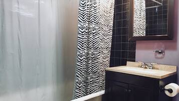 Traditional Apartment, Multiple Beds | Bathroom | Hair dryer, towels