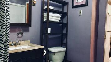 Traditional Apartment, Multiple Beds | Bathroom | Hair dryer, towels