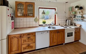 Fridge, stovetop, dishwasher, coffee/tea maker