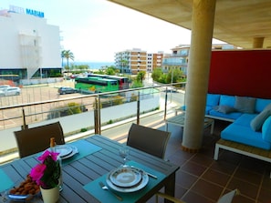 Enjoy a romantic dinner for two on the balcony with a view of the city.