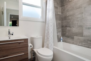 Combined shower/tub, hair dryer, towels, soap