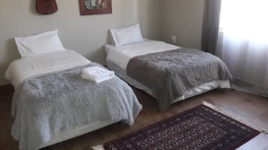 Individually furnished, desk, laptop workspace, bed sheets - Azurite Apartments (Lusaka)