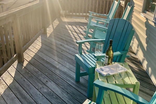 3rd floor balcony with an outdoor table and chairs.
