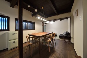 Cozy dining area with a wooden table and chairs, perfect for small gatherings.