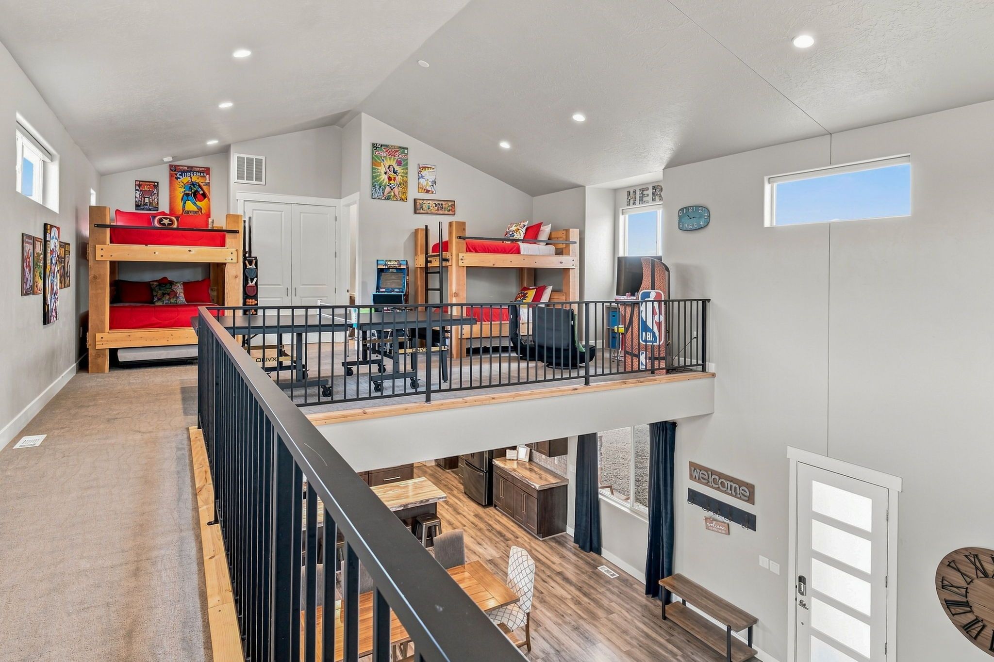 A multi-level interior with bunk beds, a kitchen, and a dining area.