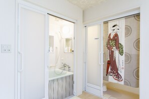 Bathtub, hair dryer, towels, soap