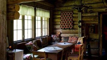 Family Cottage, Multiple Beds, Garden View | Living area | Fireplace