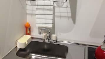Fridge, microwave, electric kettle, cookware/dishes/utensils