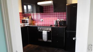 شقة - غرفة نوم واحدة | مطبخ خاص | ثلاجة/مجمد بحجم كبير، ميكروويف، فرن، موقد طهي مسطح