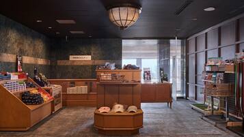 A retail space with wooden counters, a variety of packaged goods, and a NikeGolf sign.
