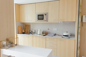 Fridge, microwave, stovetop, coffee/tea maker