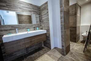 Shower, hair dryer, towels, toilet paper