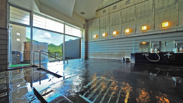 A spacious indoor pool area with a clear view of the outdoors, a sauna, and a modern bathroom with a large mirror and multiple sinks. - Yusuge' Lake Haruna SPA Ryokan (Takasaki)