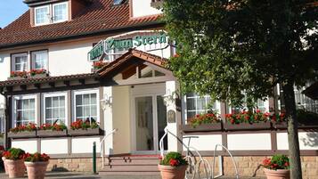 A traditional building with a sign reading "Zum Stern".
