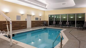 A swimming pool with a lifeguard stand, pool area, and seating by the pool. - Fairfield by Marriott Port Clinton Waterfront (Port Clinton)