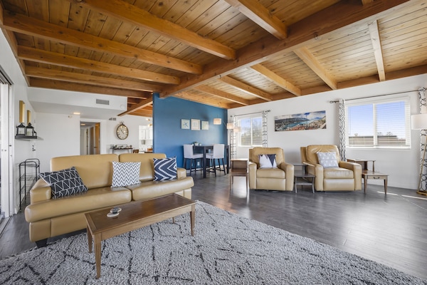 View from tv back to family area and dining room (behind blue wall)