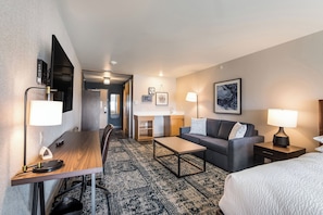 Premium bedding, desk, laptop workspace, blackout curtains
