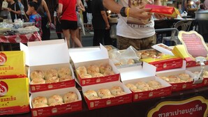 A table with multiple boxes of Phuket Buns. - Phuket Town Budget Lodge AirconRoom1+Washer (Phuket)