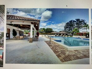 Outdoor pool - Waterfront Lake @PGA NATIONAL 2B2bath Club Cottage with Wine Basket (Palm Beach Gardens)