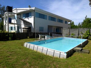 Seasonal outdoor pool, open 8:00 AM to 6:00 PM, pool umbrellas