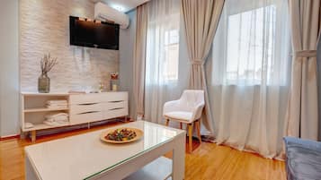 Comfort Twin Room, 1 Double Bed with Sofa bed, Garden View | Living area | Flat-screen TV