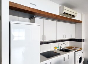 Fridge, microwave, stovetop, coffee/tea maker