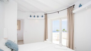 A bedroom with a bed, a view of the sea, and a balcony. - Villa ROSINA by Abahana Villas (Benissa)