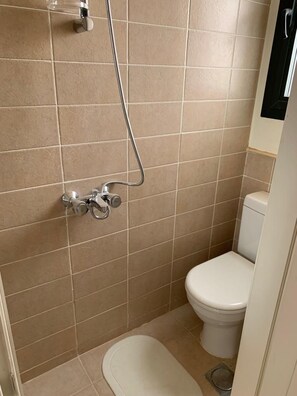 A bathroom with a shower, toilet, and a bidet. - Marassi North Coast Studio Catania (El Alamein)