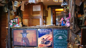 A vintage-themed shop with a wooden counter, vintage posters, and various knick-knacks. - The Paddock - Sleeping 2 - B & B Yarm double bed en suite /fridge/microwave  (High Leven)